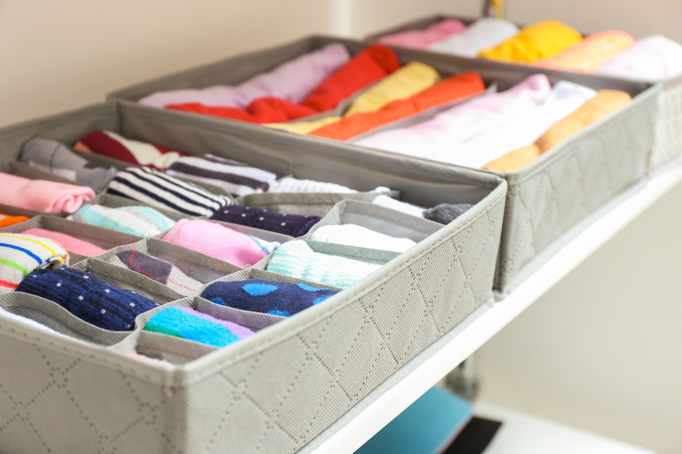 Organizers with Clean Clothes in Closet